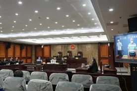 被指控受贿1293万余元！广西中医药大学原副校长覃裕旺受审图片