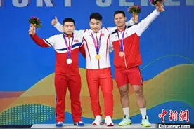 （杭州亚运会）中国朝鲜力士平分两金  世界冠军廖桂芳受伤退赛图片